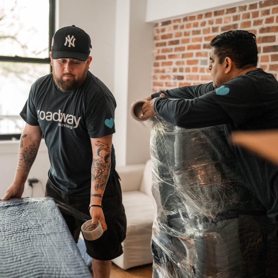 Roadway movers packing furniture